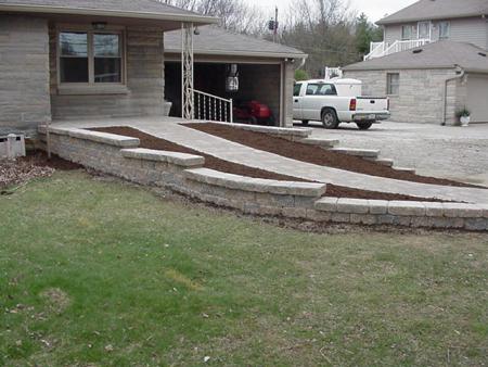 Belgard Celtik Wall &amp; Hessit Bavarian Pavers to create sloped sidewalk